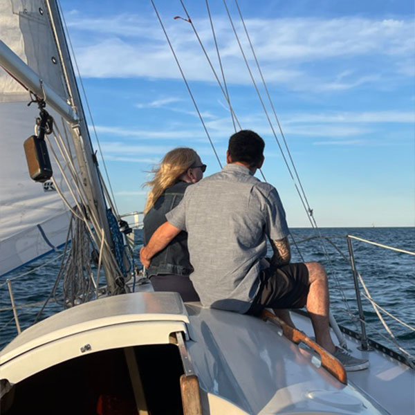 couple relaxing on a boat and looking at the horizon